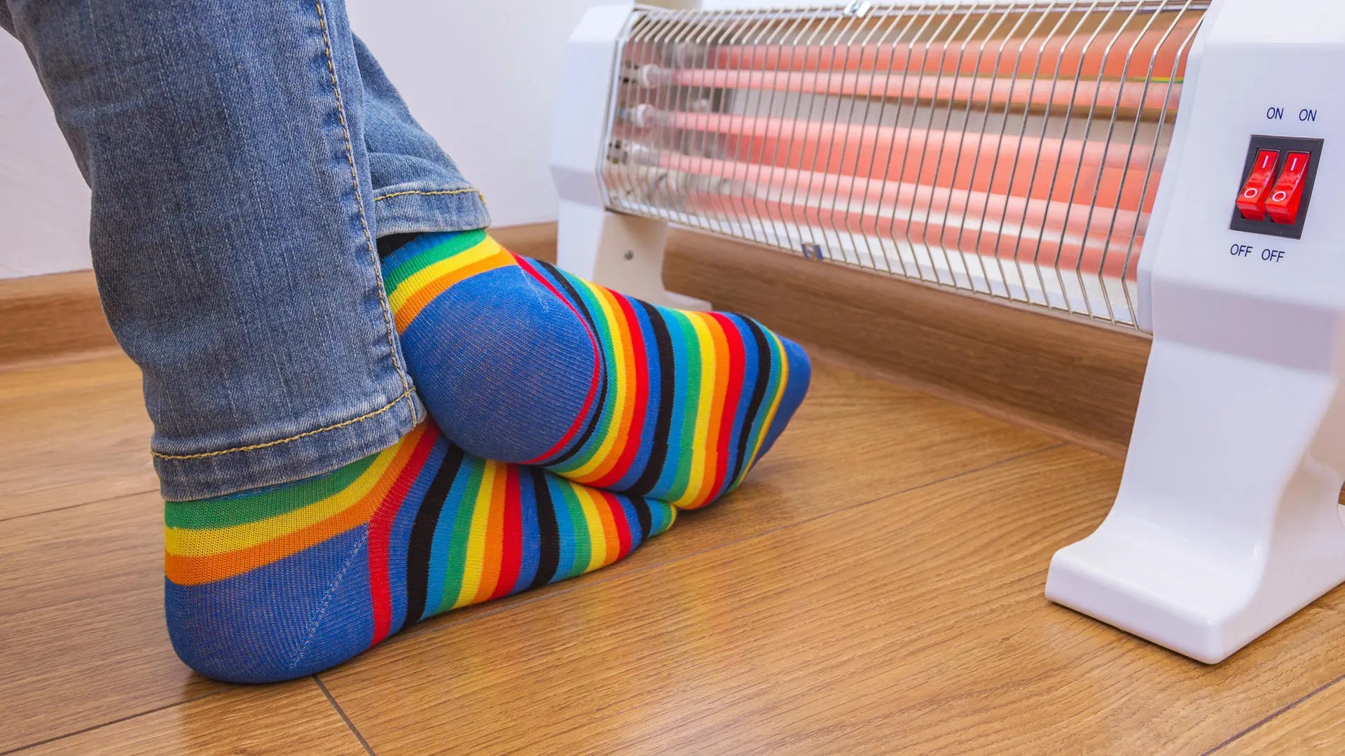 Person seated at home deciding between warmth and daily foot care support