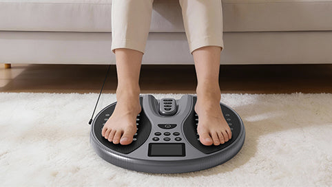 Bare feet placed on the WY-360 EMS foot stimulator foot pads